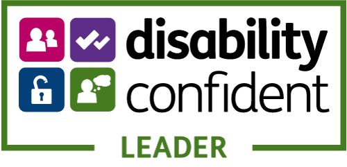 Disability Confident Leader accreditation logo. A white rectangular badge with a green border and four icons in pink, purple, blue, and green representing inclusion, verification, accessibility, and awareness. The text reads 'disability confident LEADER'.
