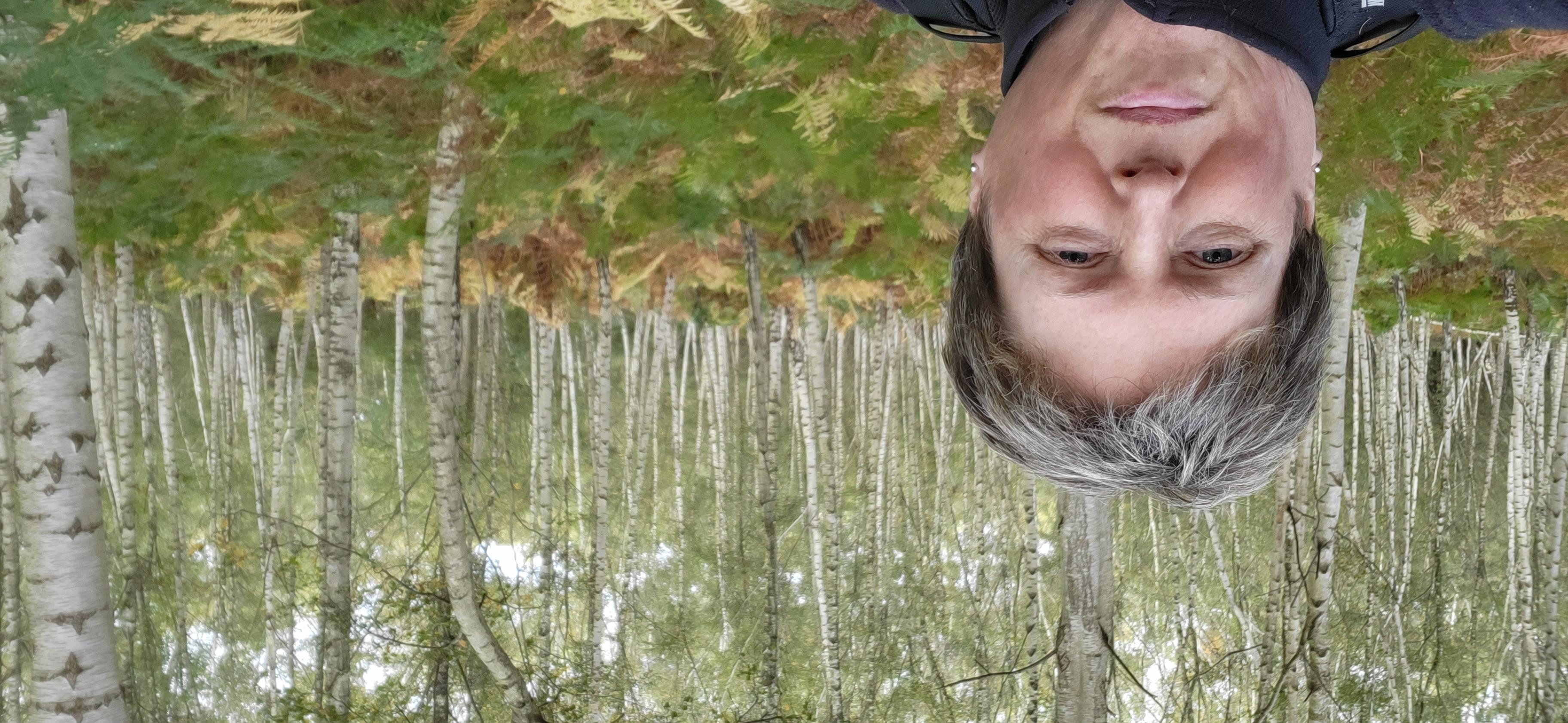 Sam from DWP, selfie in forest. 