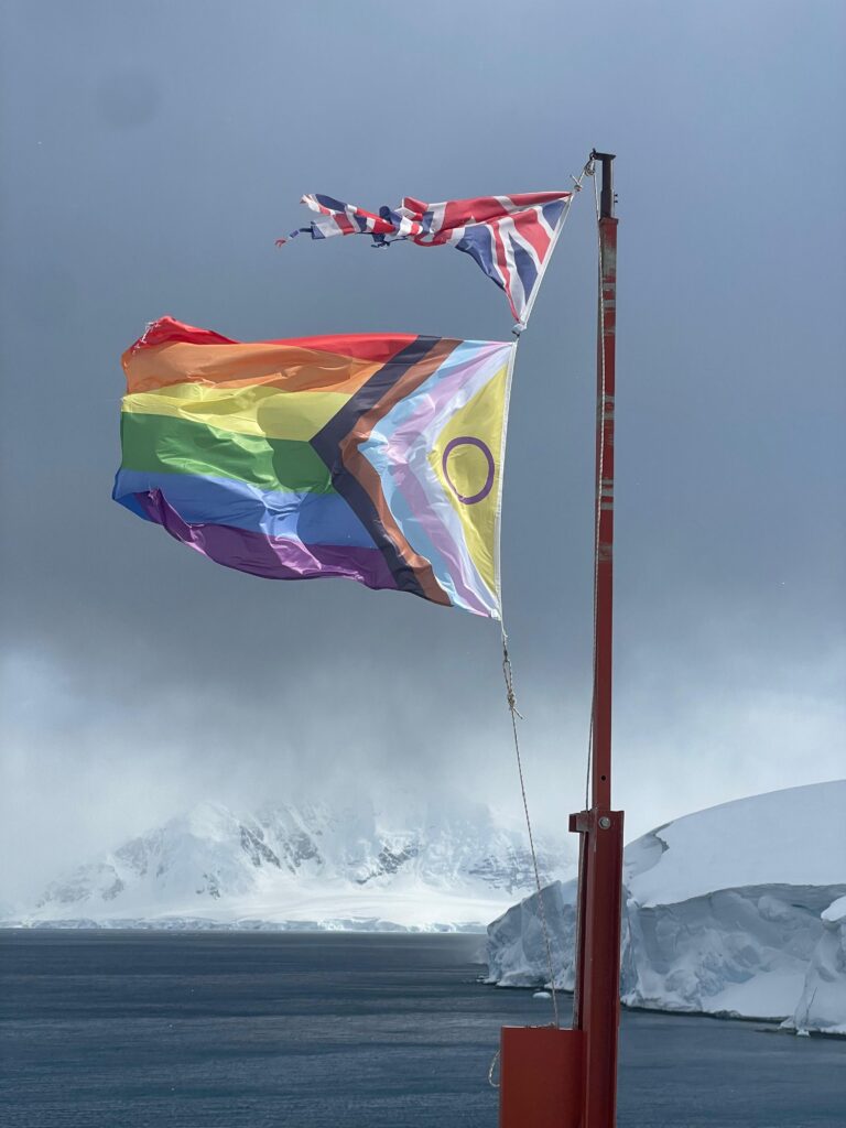 The progress Pride flag flying at Rothera Research Station (Aurelia Reichardt)