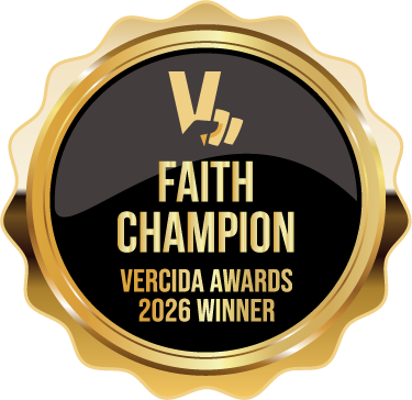 A circular gold and black digital award badge featuring a stylized "V" logo and the text "FAITH CHAMPION VERCIDA AWARDS 2026 WINNER" in bold gold lettering.