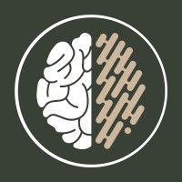NeuroBridge logo - At the centre is a stylized depiction of a human brain divided vertically into two distinct halves: Left Hemisphere: Rendered in solid white, featuring smooth, traditional organic brain folds (gyri and sulci). Right Hemisphere: Rendered in a beige/tan colour, composed of a geometric, abstract pattern made of diagonal parallel capsule shapes and dots, resembling circuit board traces or digital data streams.