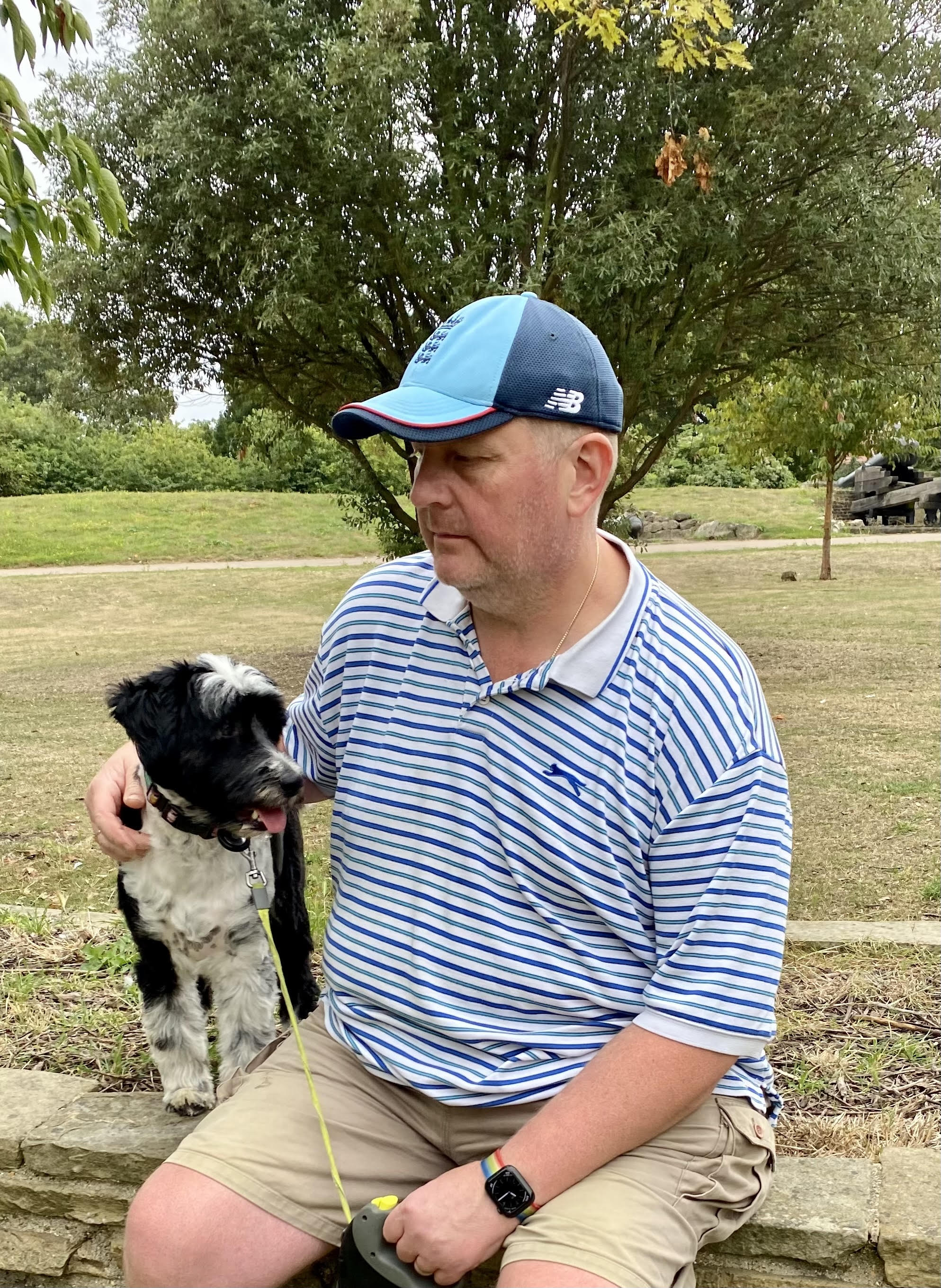 David, the Social Mobility lead for CFCD, enjoying some time outdoors with his black-and-white dog. He is pictured in a park setting, reflecting the personal side of the leaders driving DWP&rsquo;s inclusion initiatives.