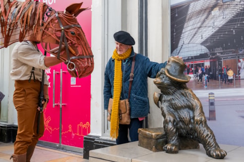 Michale leaning next to Paddington bear