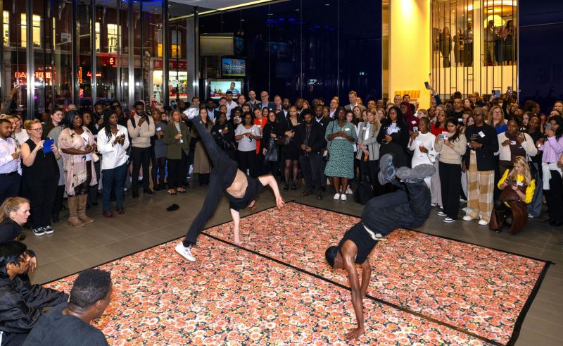 black dancers on the centre stage with a large crowd of people around them