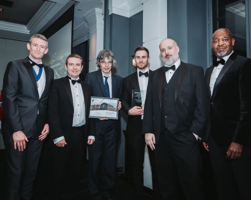 A group of engineers accepting the IStructE Award