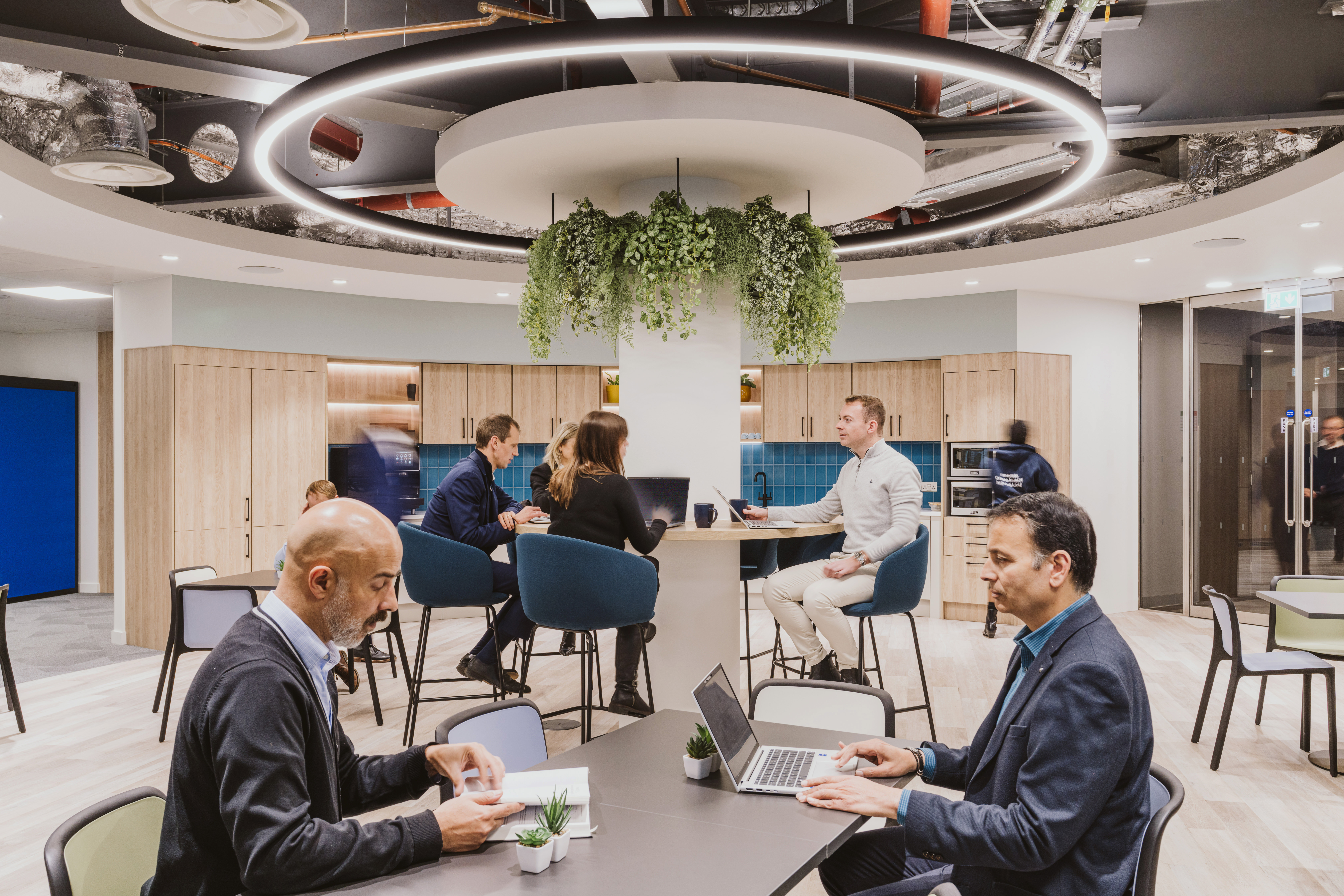 RSSB collegues working in a flexible space