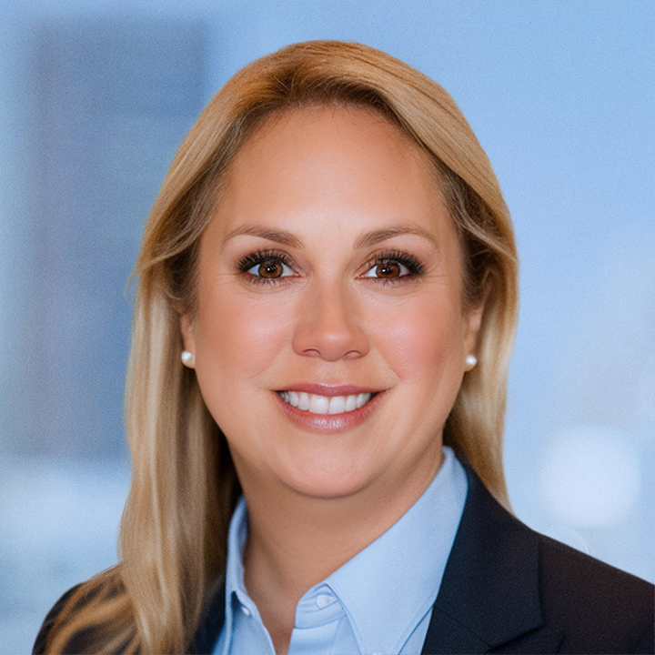 Allison McLeary white woman with blond hair, brown eyes  wearing a light blue shirt and a dark blue jacket