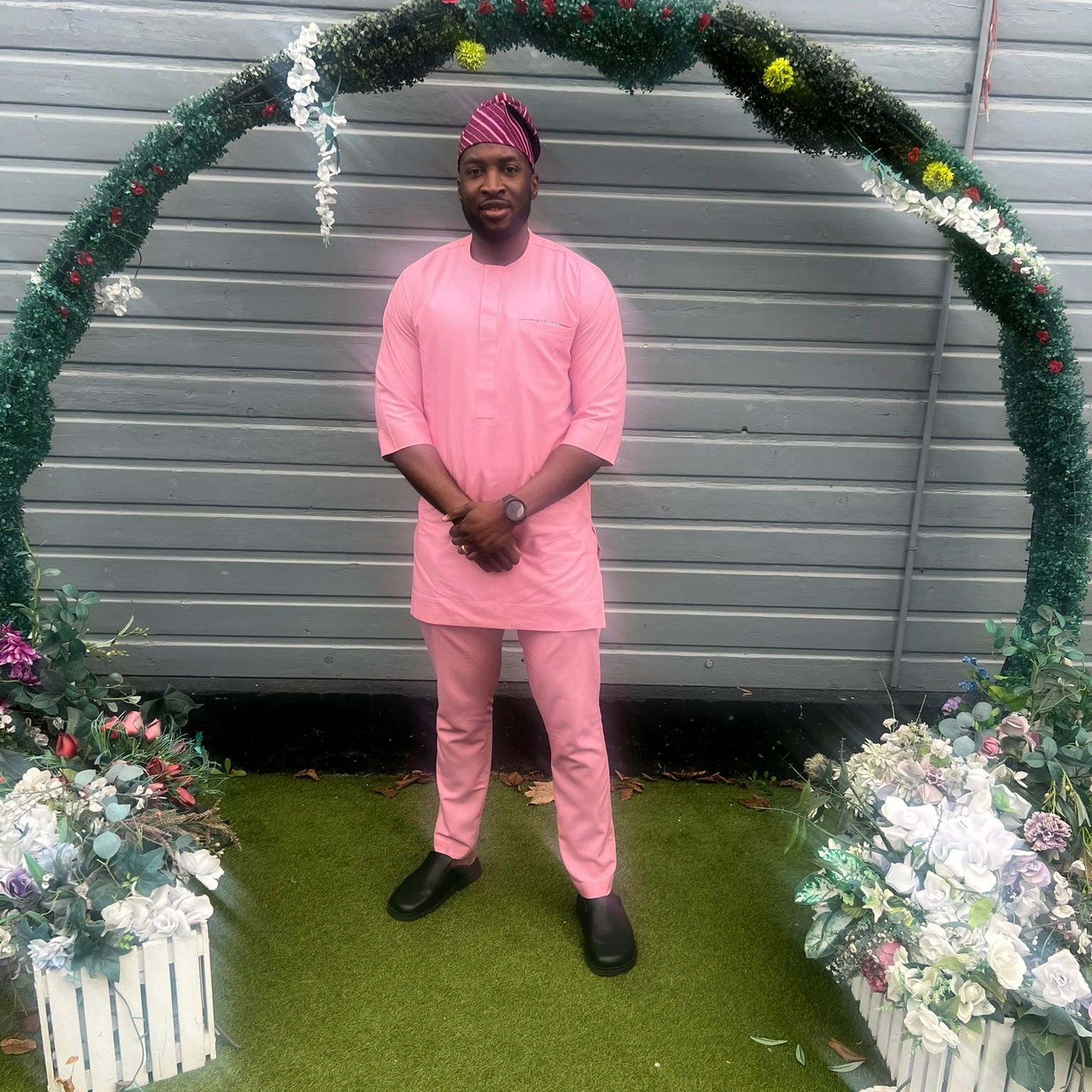 Kay in a pink traditional Nigerian dress