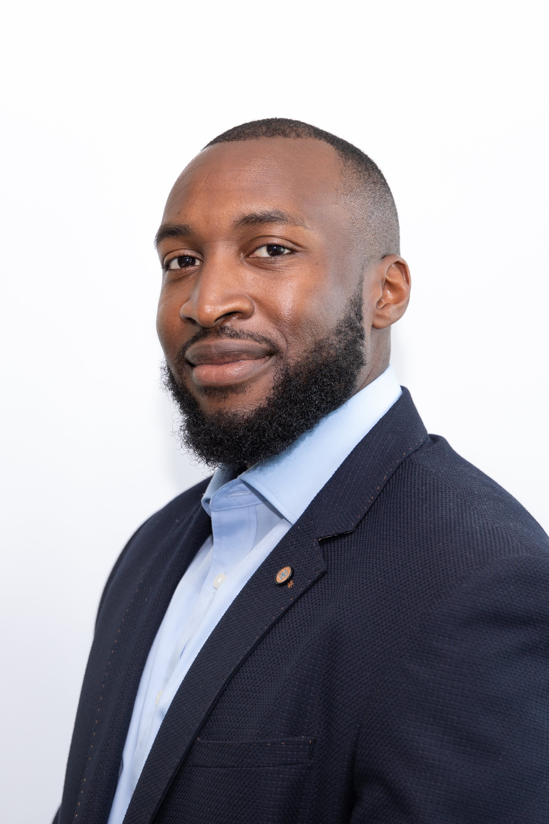Kay a black young male in blue suite