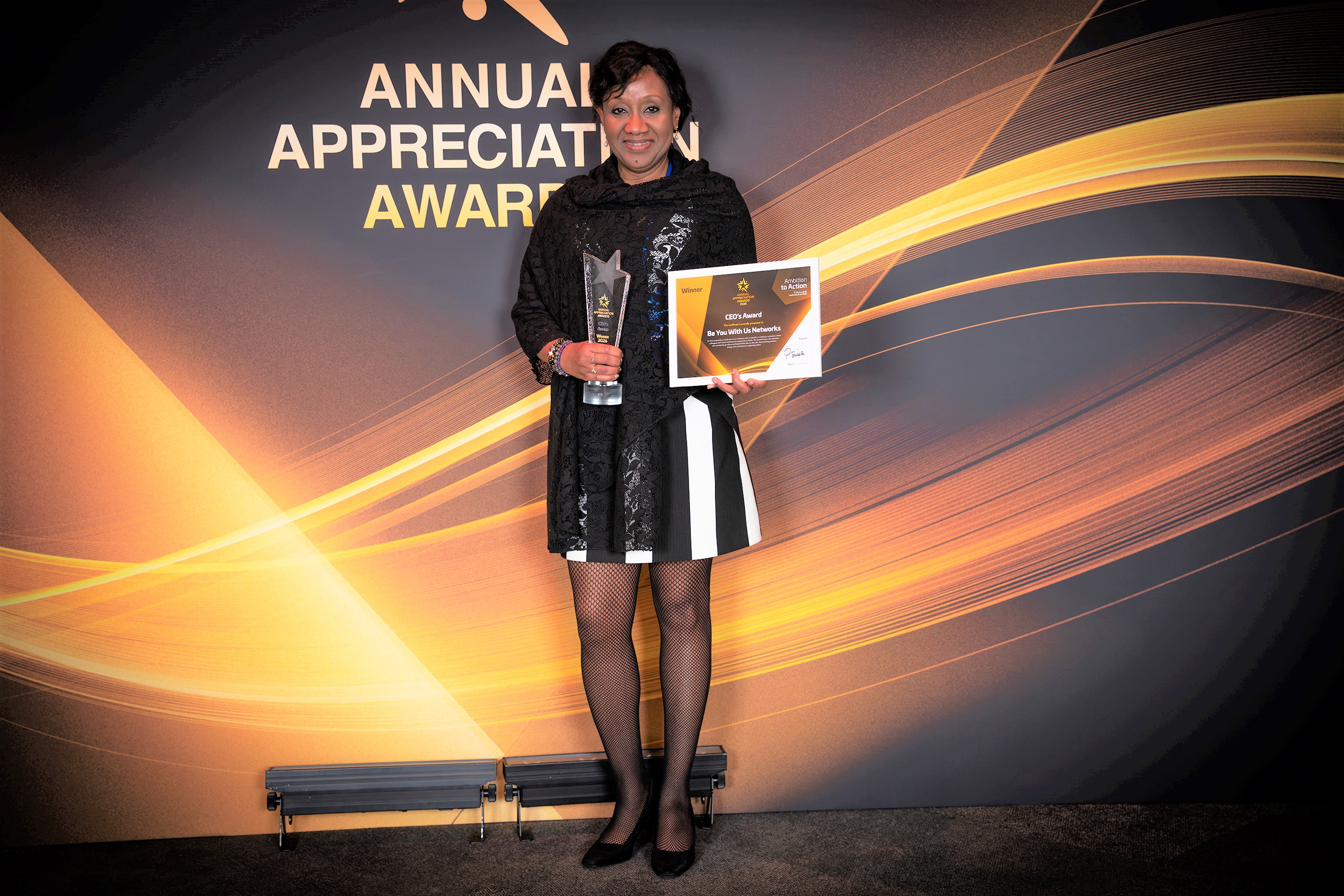 Gertrude receiving CEO&rsquo;s Appreciation Award on behalf of REACH.