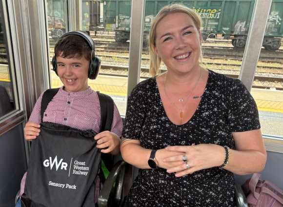 A white mother and autistic son on a GWR train