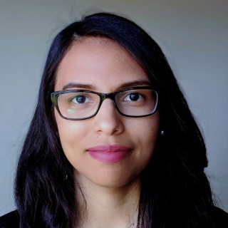 A women with dark brown shoulder length hair