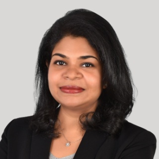 A women with dark brown shoulder length hair