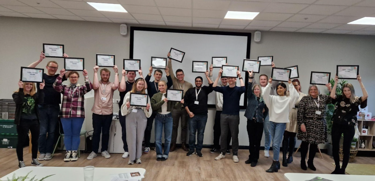 Learning and Development at Hillarys - colleagues holding their training certificates