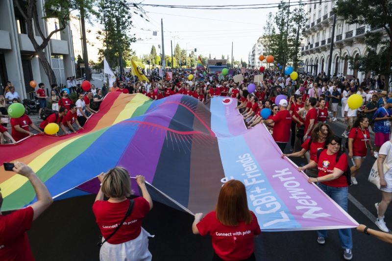 Vodafone team holding a Pride flag