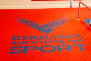 English Institute of Sport wording on a red background