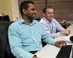 2 FA  office staff at a computer.