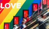 escalator with rainbow color wall with love