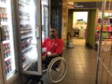 Asian man in a wheel chair
