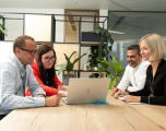 Female and male employees in office setting