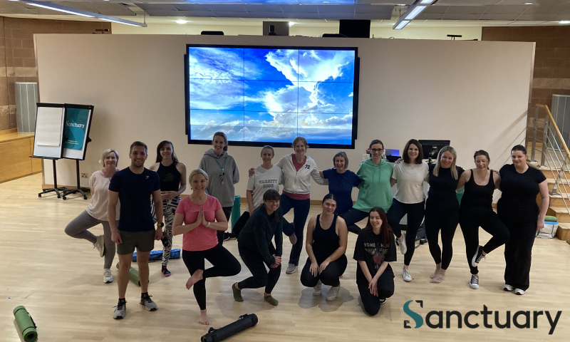 Sanctuary employees in a yoga session