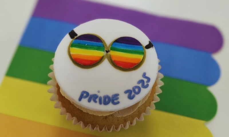 A muffin with a Pride flag