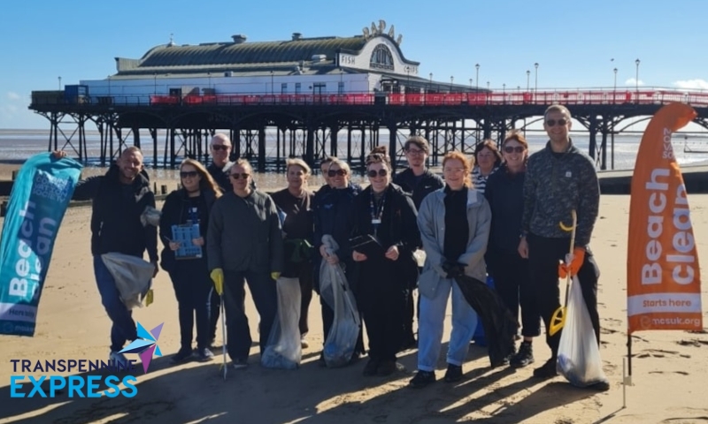 TPE employees of different race and genders on a beach