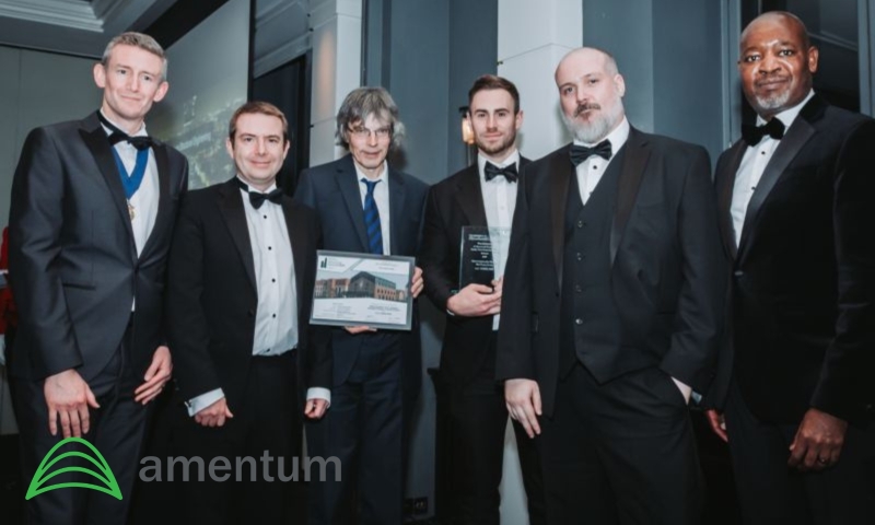 A group of male engineers with the IStructE Award