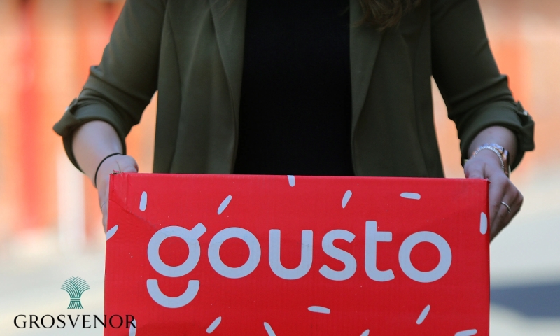 gousto box being held by a woman