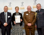 Mott Mac collegues standing with armed forces personnal